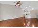 Large living room with hardwood floors, ceiling fan, and plenty of natural light at 6706 Fairway Gardens Dr # 6706, Bradenton, FL 34203