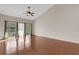 This expansive living room showcases hardwood floors and sliding glass doors to a patio at 6706 Fairway Gardens Dr # 6706, Bradenton, FL 34203