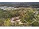 Aerial view of house, pool, and surrounding landscape at 6939 Corral Gate Ln, Sarasota, FL 34241