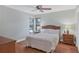 Serene bedroom with hardwood floors and nightstand at 6939 Corral Gate Ln, Sarasota, FL 34241