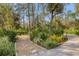 Landscaped garden path with stone and lush greenery at 6939 Corral Gate Ln, Sarasota, FL 34241