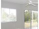 Spacious bedroom with large windows and sliding glass doors at 7212 Southgate Ct, Sarasota, FL 34243