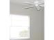 Simple bedroom with window and ceiling fan at 7212 Southgate Ct, Sarasota, FL 34243