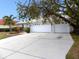 Two-car garage and driveway of a single-story home at 7212 Southgate Ct, Sarasota, FL 34243