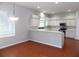 Modern kitchen featuring white cabinetry, stainless steel appliances, and tile floors at 7212 Southgate Ct, Sarasota, FL 34243