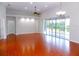 Spacious living area with tile floors and access to a patio at 7212 Southgate Ct, Sarasota, FL 34243