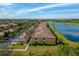 Aerial view of community, featuring lake, golf course, and multiple homes at 7315 River Hammock Dr # 206, Bradenton, FL 34212