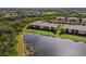 Aerial view of building near lake and golf course at 7315 River Hammock Dr # 206, Bradenton, FL 34212