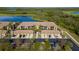 Aerial view of community with lake and lush landscaping at 7315 River Hammock Dr # 206, Bradenton, FL 34212