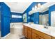 Spa-like bathroom with soaking tub, double vanity, and window at 7315 River Hammock Dr # 206, Bradenton, FL 34212