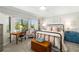 Charming bedroom with a comfortable bed and built-in desk area at 7315 River Hammock Dr # 206, Bradenton, FL 34212