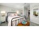 Serene bedroom with a metal bed frame and calming decor at 7315 River Hammock Dr # 206, Bradenton, FL 34212