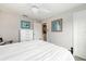 Spacious bedroom with white bedding and dresser at 7315 River Hammock Dr # 206, Bradenton, FL 34212