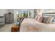 Spacious Primary bedroom with a king bed and plenty of natural light at 7315 River Hammock Dr # 206, Bradenton, FL 34212