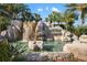Community entrance with waterfall feature and River Strand signage at 7315 River Hammock Dr # 206, Bradenton, FL 34212
