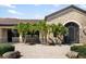 Community clubhouse with stone exterior and wrought-iron gate at 7315 River Hammock Dr # 206, Bradenton, FL 34212