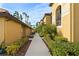 Exterior walkway showcasing building and landscaping details at 7315 River Hammock Dr # 206, Bradenton, FL 34212