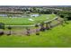 Golf course with a pond and palm trees at 7315 River Hammock Dr # 206, Bradenton, FL 34212
