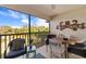 Outdoor lanai with table and chairs, offering scenic views at 7315 River Hammock Dr # 206, Bradenton, FL 34212