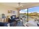 Relaxing lanai with wicker furniture and scenic water views at 7315 River Hammock Dr # 206, Bradenton, FL 34212
