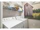 Laundry room with washer, dryer, and shelving at 7315 River Hammock Dr # 206, Bradenton, FL 34212