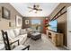 Cozy living room with comfortable seating and large TV at 7315 River Hammock Dr # 206, Bradenton, FL 34212