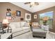 Relaxing living room featuring a sofa, armchair, and ottoman at 7315 River Hammock Dr # 206, Bradenton, FL 34212