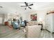 Spacious living room with comfortable seating and a view into the kitchen at 7315 River Hammock Dr # 206, Bradenton, FL 34212