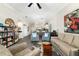 Open living room with ample seating and views into kitchen at 7315 River Hammock Dr # 206, Bradenton, FL 34212