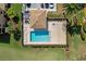 Community pool with lounge chairs and covered patio area at 7315 River Hammock Dr # 206, Bradenton, FL 34212