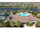 Community clubhouse with pool and tennis courts, near the lake at 7315 River Hammock Dr # 206, Bradenton, FL 34212
