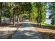 Scenic lakeside walking path surrounded by lush trees at 7315 River Hammock Dr # 206, Bradenton, FL 34212