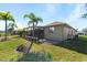 Spacious backyard with screened pool and patio area at 7518 Paspalum, Punta Gorda, FL 33955