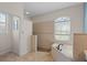 Bathroom with walk-in shower and soaking tub at 7518 Paspalum, Punta Gorda, FL 33955