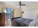 Bedroom with sliding doors to the pool area at 7518 Paspalum, Punta Gorda, FL 33955