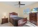 Spacious bedroom with a TV and dresser at 7518 Paspalum, Punta Gorda, FL 33955