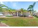 Front view of house showcasing landscaping and entryway at 7518 Paspalum, Punta Gorda, FL 33955