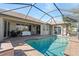 Enclosed pool area with patio and grill at 7518 Paspalum, Punta Gorda, FL 33955