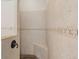 Walk-in shower with tiled walls and built-in seat at 7518 Paspalum, Punta Gorda, FL 33955