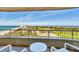 Stunning balcony view overlooking the ocean, beach, and cityscape, perfect for outdoor relaxation and entertainment at 775 Longboat Club Rd # 902, Longboat Key, FL 34228