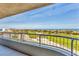 Scenic balcony view overlooking the ocean, golf course, and surrounding cityscape at 775 Longboat Club Rd # 902, Longboat Key, FL 34228