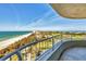 Expansive beach and ocean views from this condo balcony, overlooking the beautiful coastline and manicured green spaces at 775 Longboat Club Rd # 902, Longboat Key, FL 34228