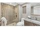 Modern bathroom with a glass-enclosed shower, granite countertop vanity, and neutral tile throughout at 775 Longboat Club Rd # 902, Longboat Key, FL 34228