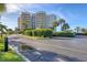 Luxury condominium building with meticulously maintained landscaping and roundabout drive at 775 Longboat Club Rd # 902, Longboat Key, FL 34228