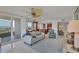 Open-concept living room flows into the dining area with ocean views, creating an ideal entertaining space at 775 Longboat Club Rd # 902, Longboat Key, FL 34228