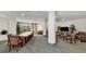 Spacious community meeting room with a large table, comfortable seating, and ample natural light at 775 Longboat Club Rd # 902, Longboat Key, FL 34228