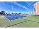 Well-maintained tennis court area with high fencing at 775 Longboat Club Rd # 902, Longboat Key, FL 34228