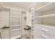 Organized walk-in closet with custom shelving and ample storage space at 775 Longboat Club Rd # 902, Longboat Key, FL 34228