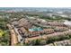 Aerial view of community showing homes, pool, and tennis courts at 8335 Glenrose Way # 1513, Sarasota, FL 34238