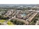 Aerial view of community showing homes, pool, and tennis courts at 8335 Glenrose Way # 1513, Sarasota, FL 34238